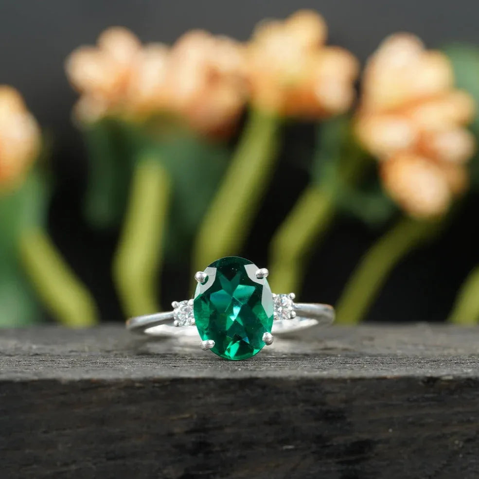 Oval Cut Emerald & Zirconia Three Stone Engagement Ring - MinimalistJewels