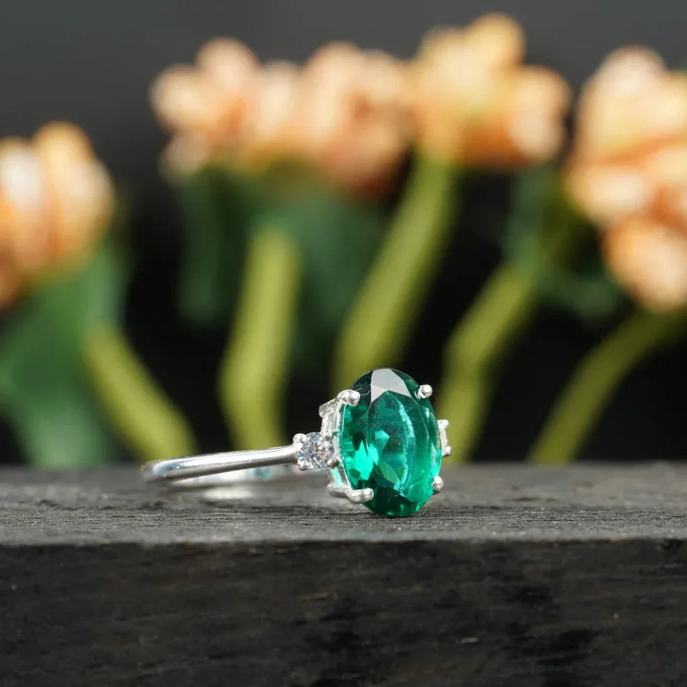 Oval Cut Emerald & Zirconia Three Stone Engagement Ring - MinimalistJewels