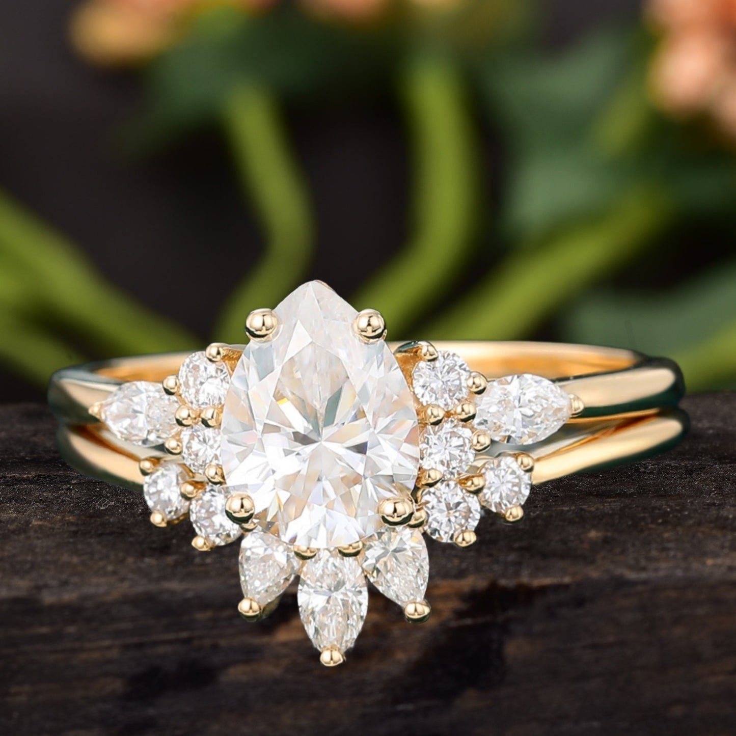 Pear shaped Moissanite engagement ring set with curved band