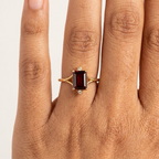 Emerald Cut Red Garnet Engagement Ring With Model Finger
