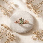 Long Hexagon Cut Moss Agate Leaf Solitaire Ring Stand on stone