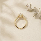 Oval Moissanite Solitaire Ring On Table