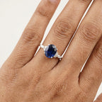 Oval Cut Blue Sapphire Sterling Silver Engagement Ring With Model Finger
