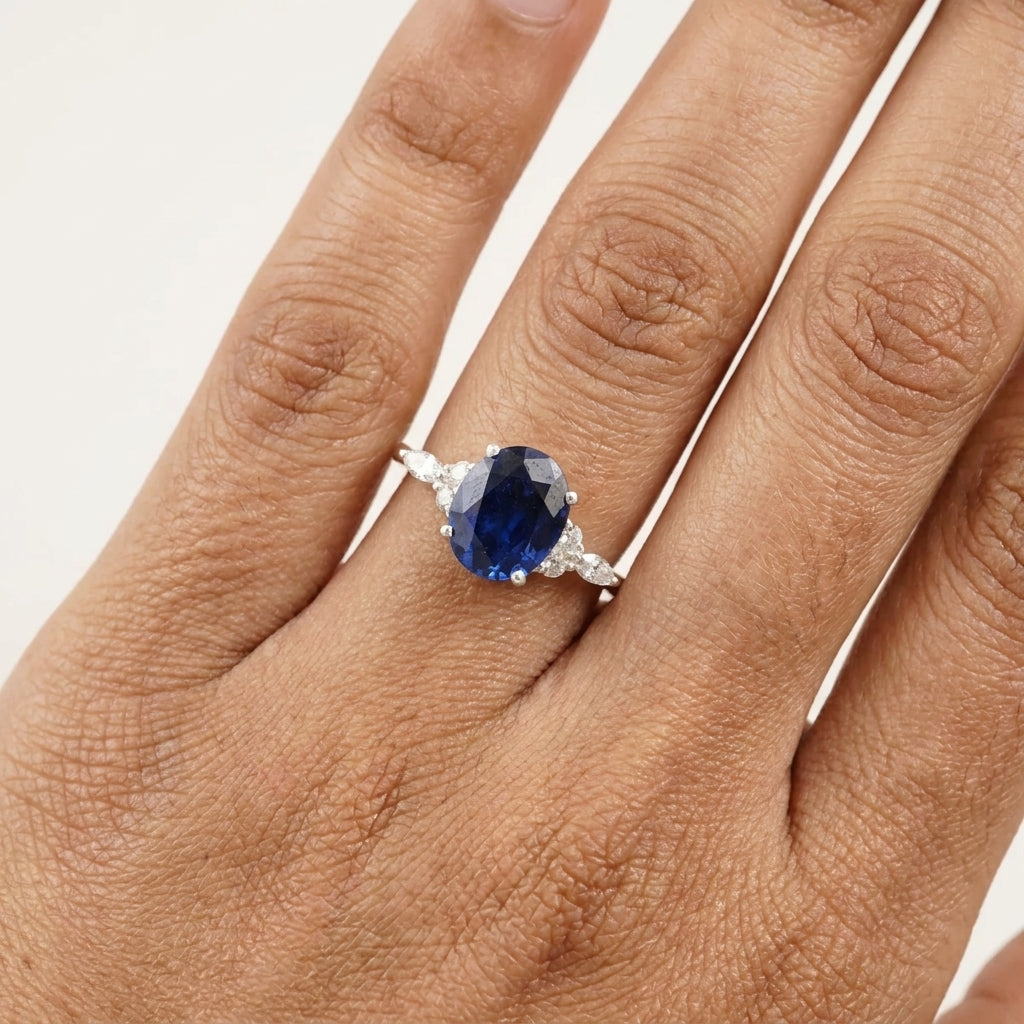 Oval Cut Blue Sapphire Sterling Silver Engagement Ring With Model Finger