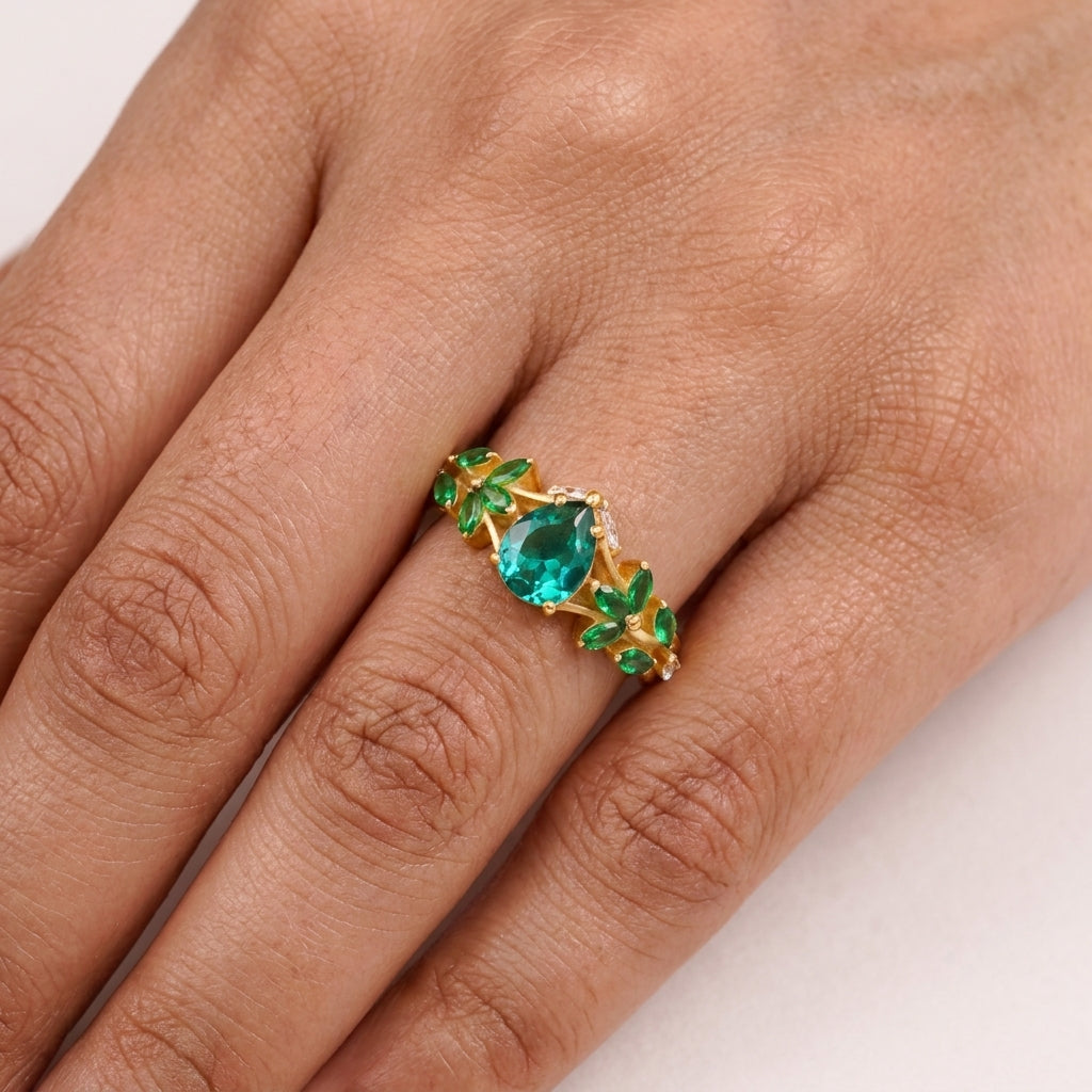 Pear Emerald Cluster Marquise Gold Engagement Ring With Model Finger