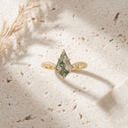 Kite Moss Agate Halo Diamond Engagement Ring STand On table