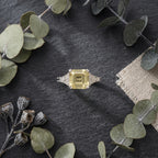 Yellow Moissanite Asscher Cut Engagement Ring on Table
