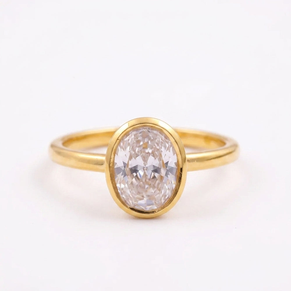 Oval Cut Bezel Set Gold Engagement Ring