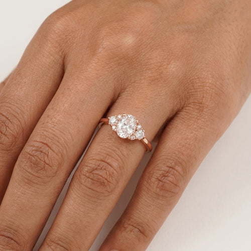 1.5ct Oval Cut Moissanite Cluster Rose Gold Engagement Ring With Model Finger